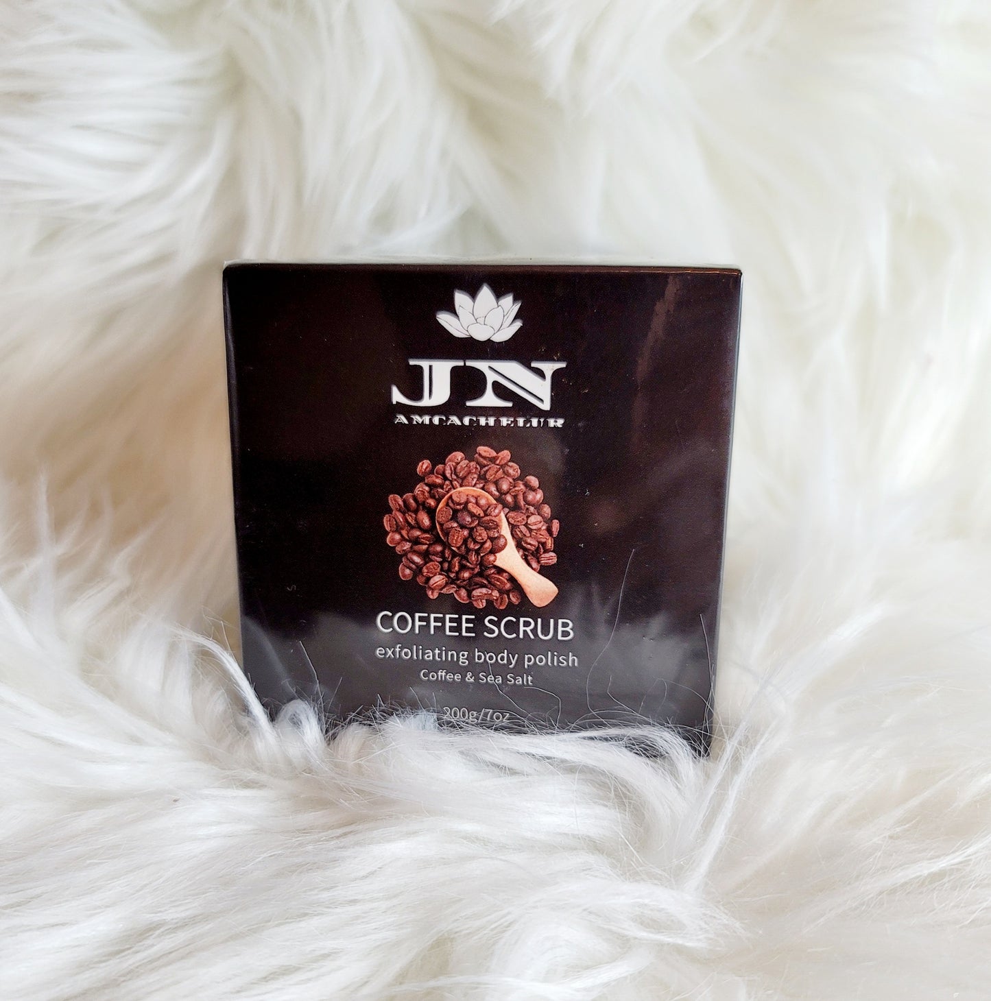 JNA coffee body scrub with essential oils and cream.