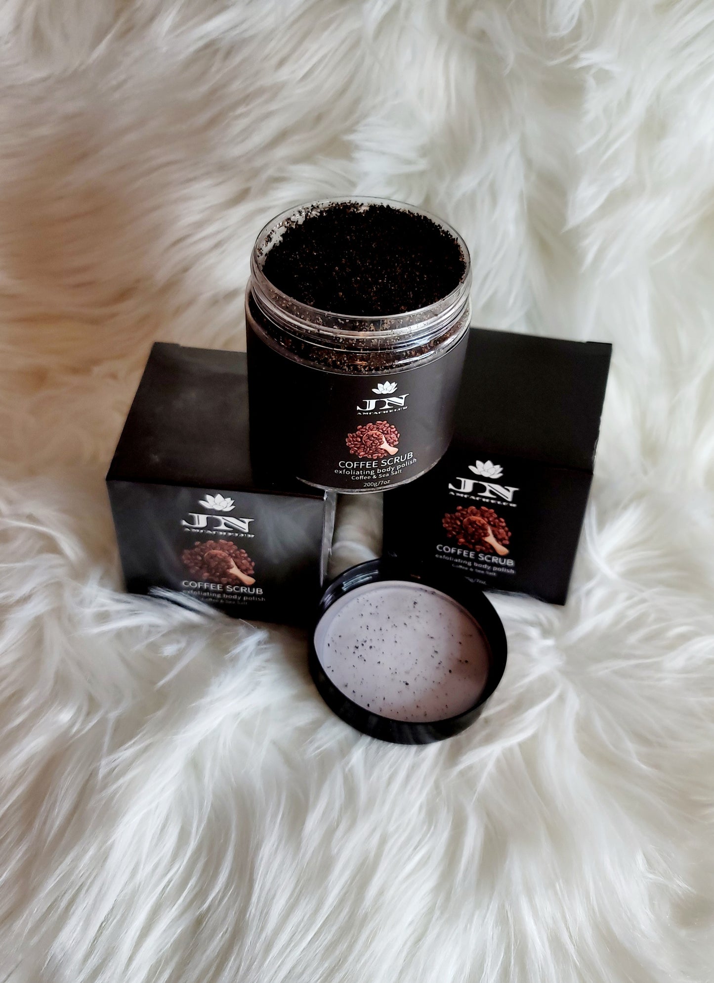 JNA coffee body scrub with essential oils and cream.