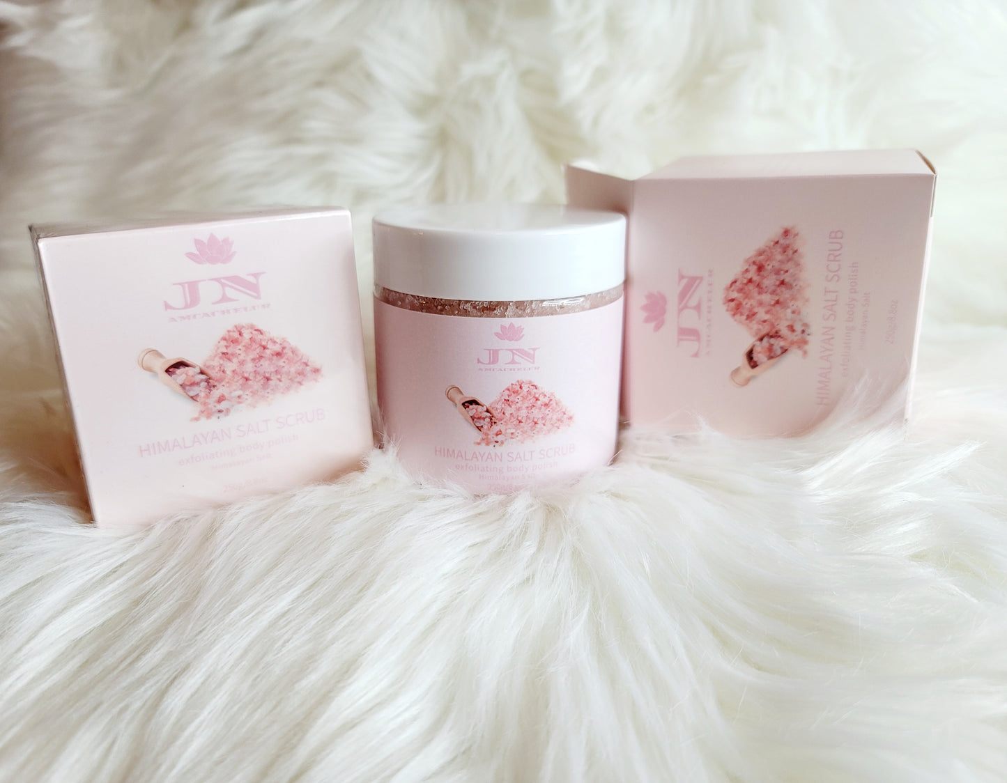 JNA Himalayan salt body scrub in pink packaging.