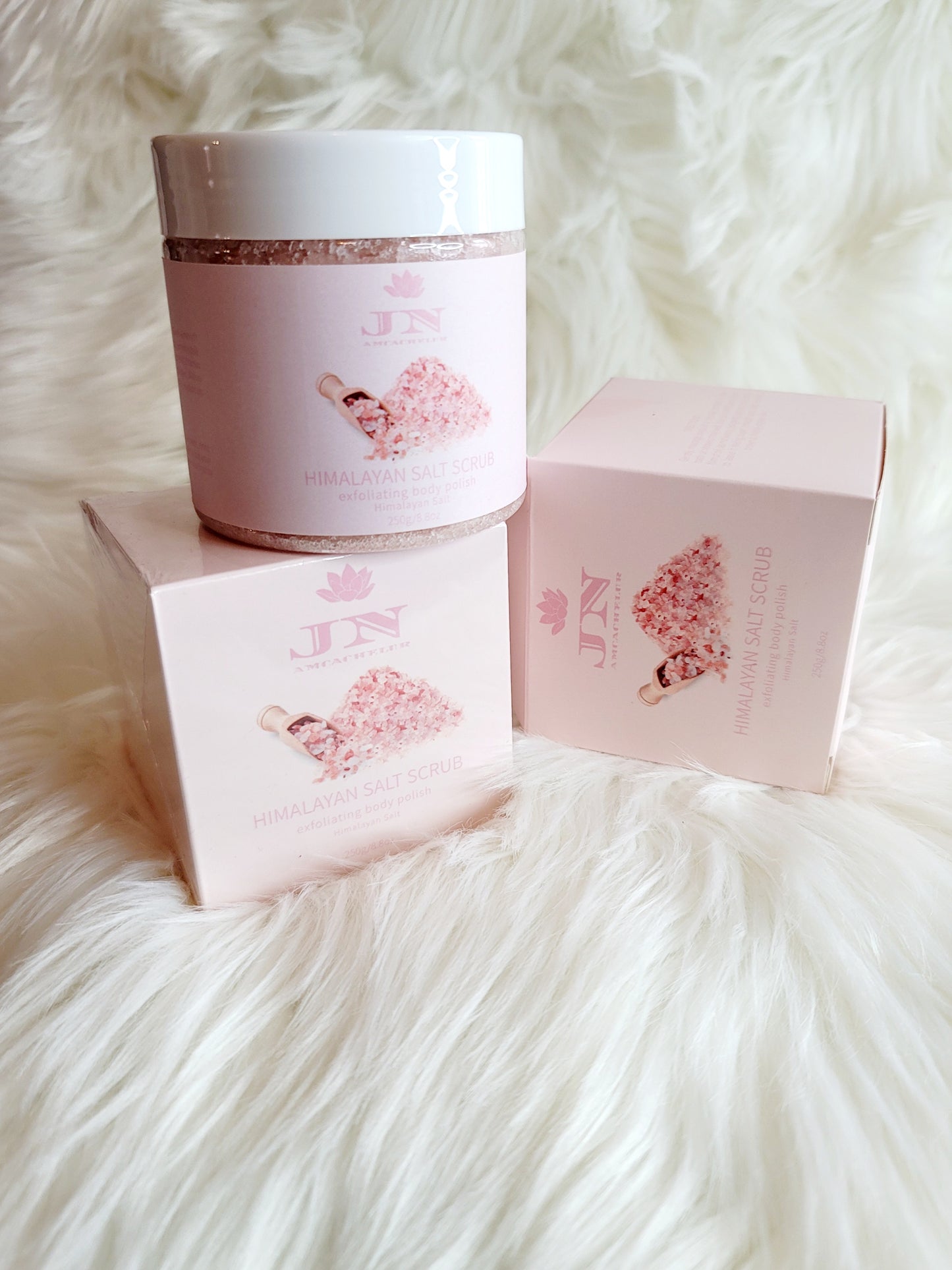 JNA Himalayan salt body scrub in pink packaging.