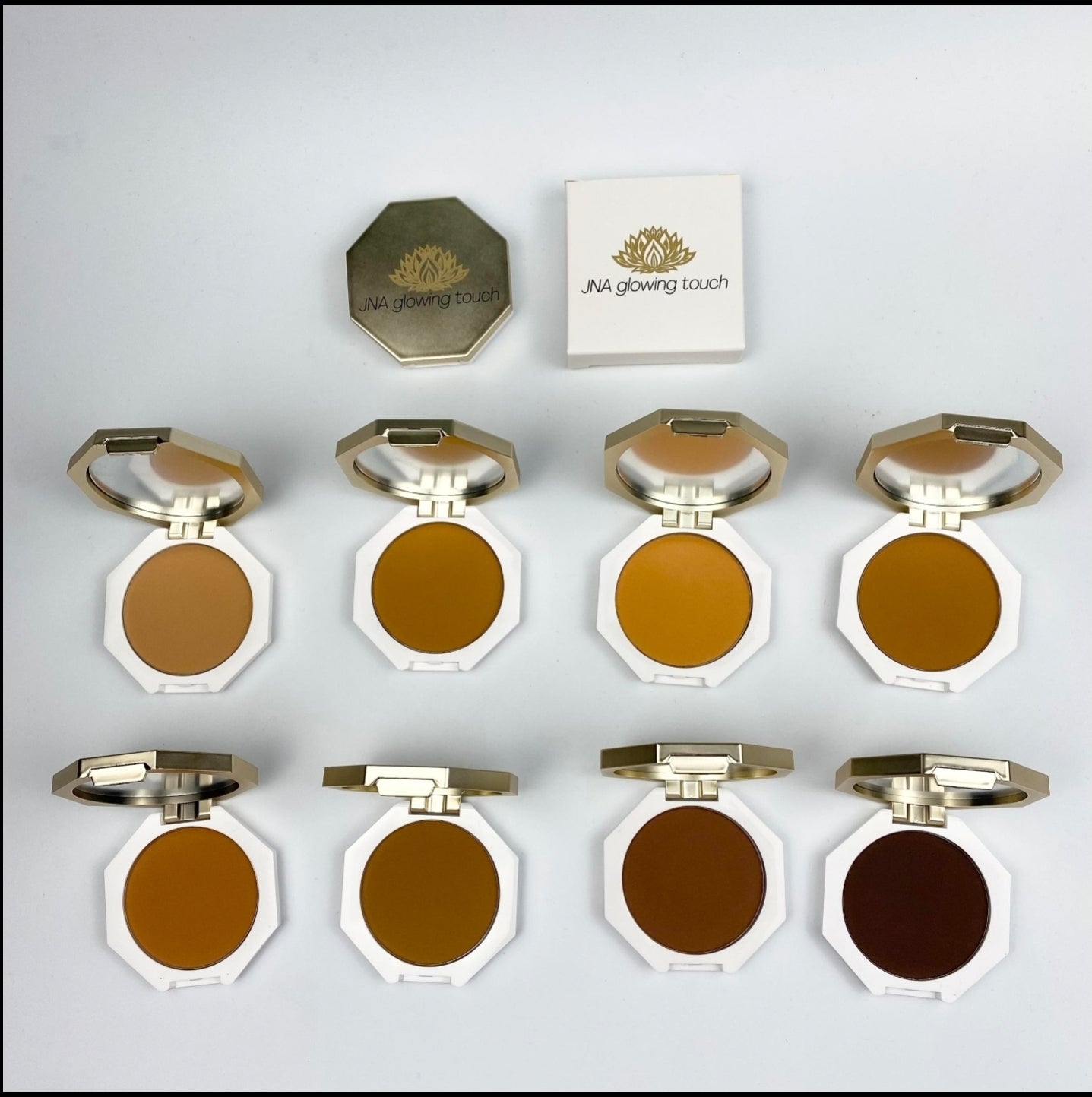 Various color options of JNA Glowing Touch golden compact powder foundation.