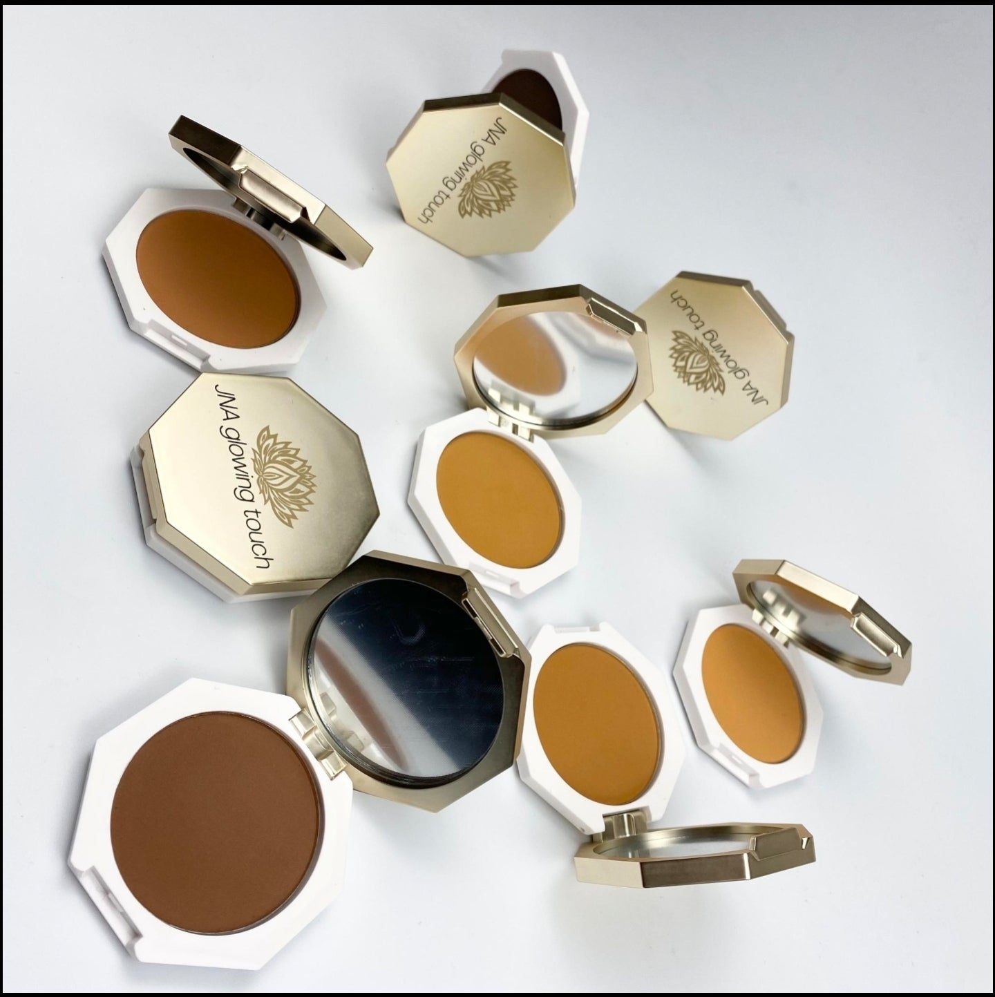 Various color options of JNA Glowing Touch golden compact powder foundation.