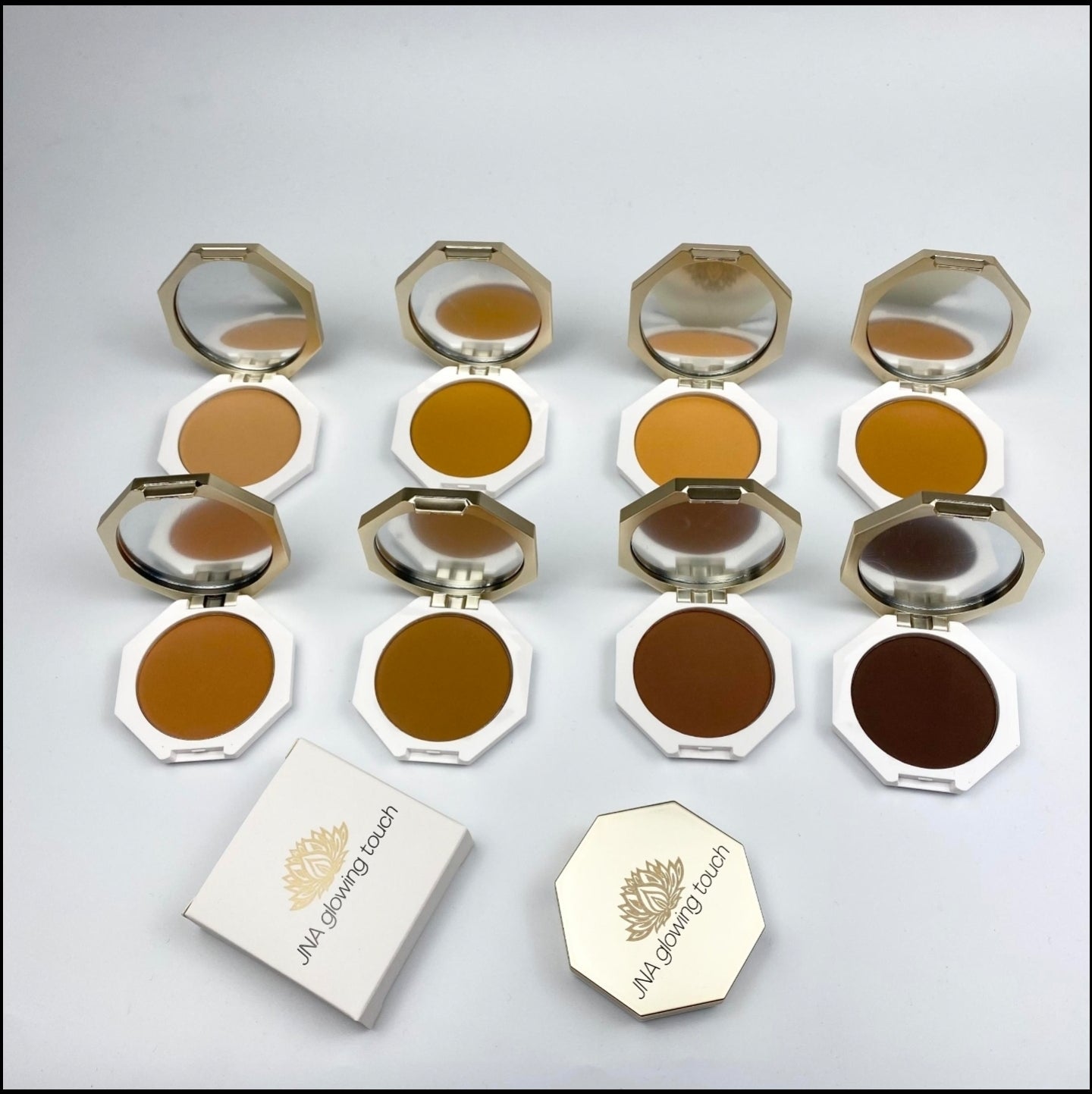 Various color options of JNA Glowing Touch golden compact powder foundation.