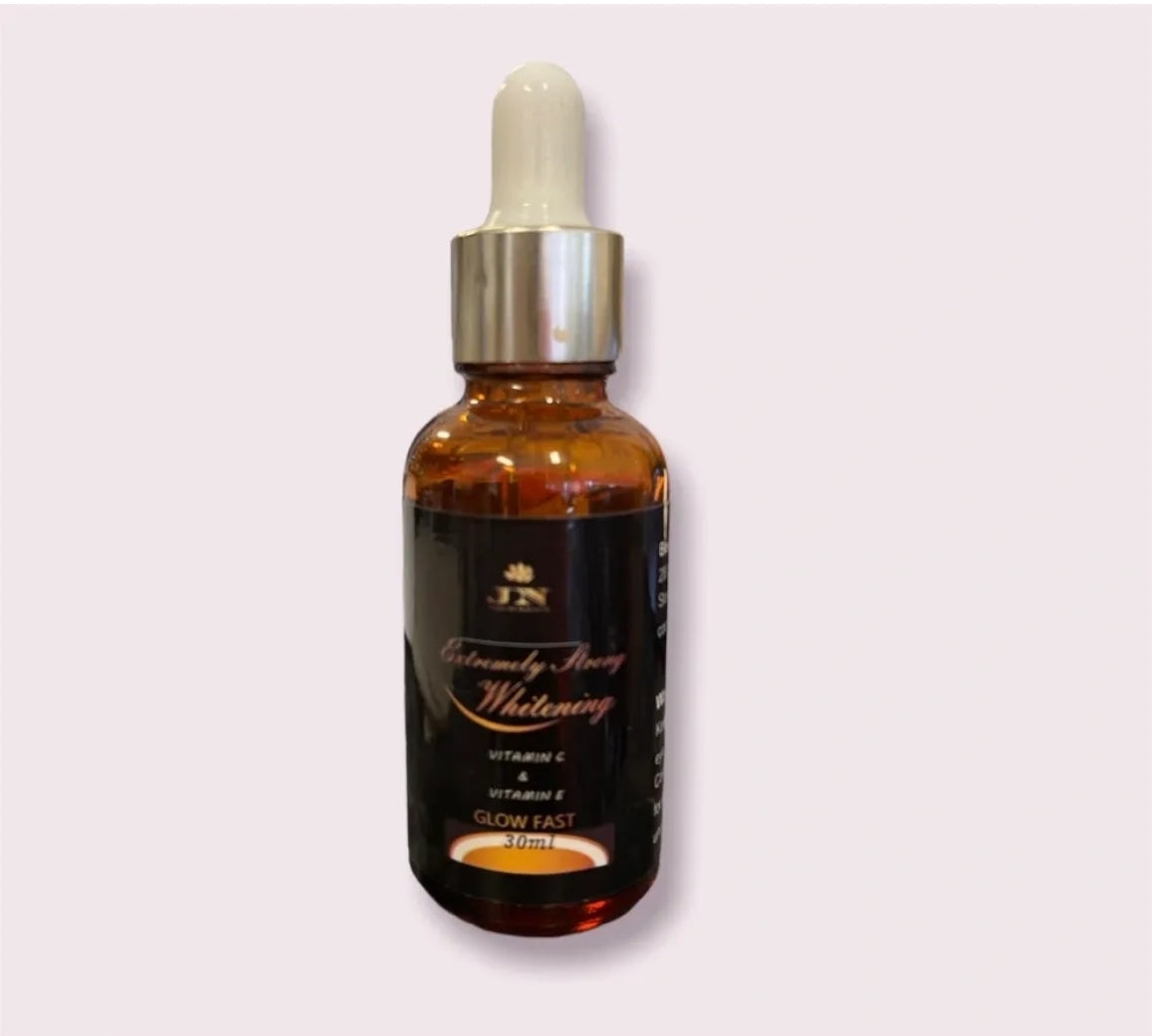 JNA glowing touch brown and black skin face serum displayed.