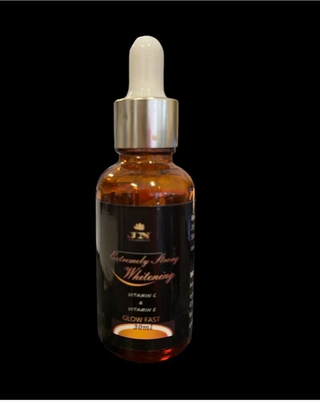 JNA glowing touch brown and black skin face serum displayed.