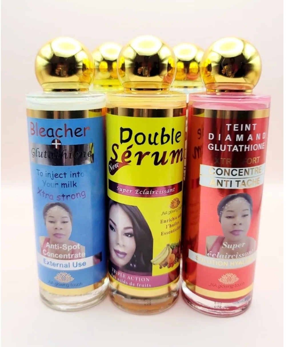 Display of three JNA anti-aging glowing touch serum bottles.