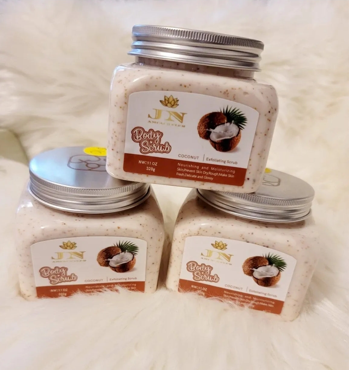 Three containers of JNA coconut body scrub set.