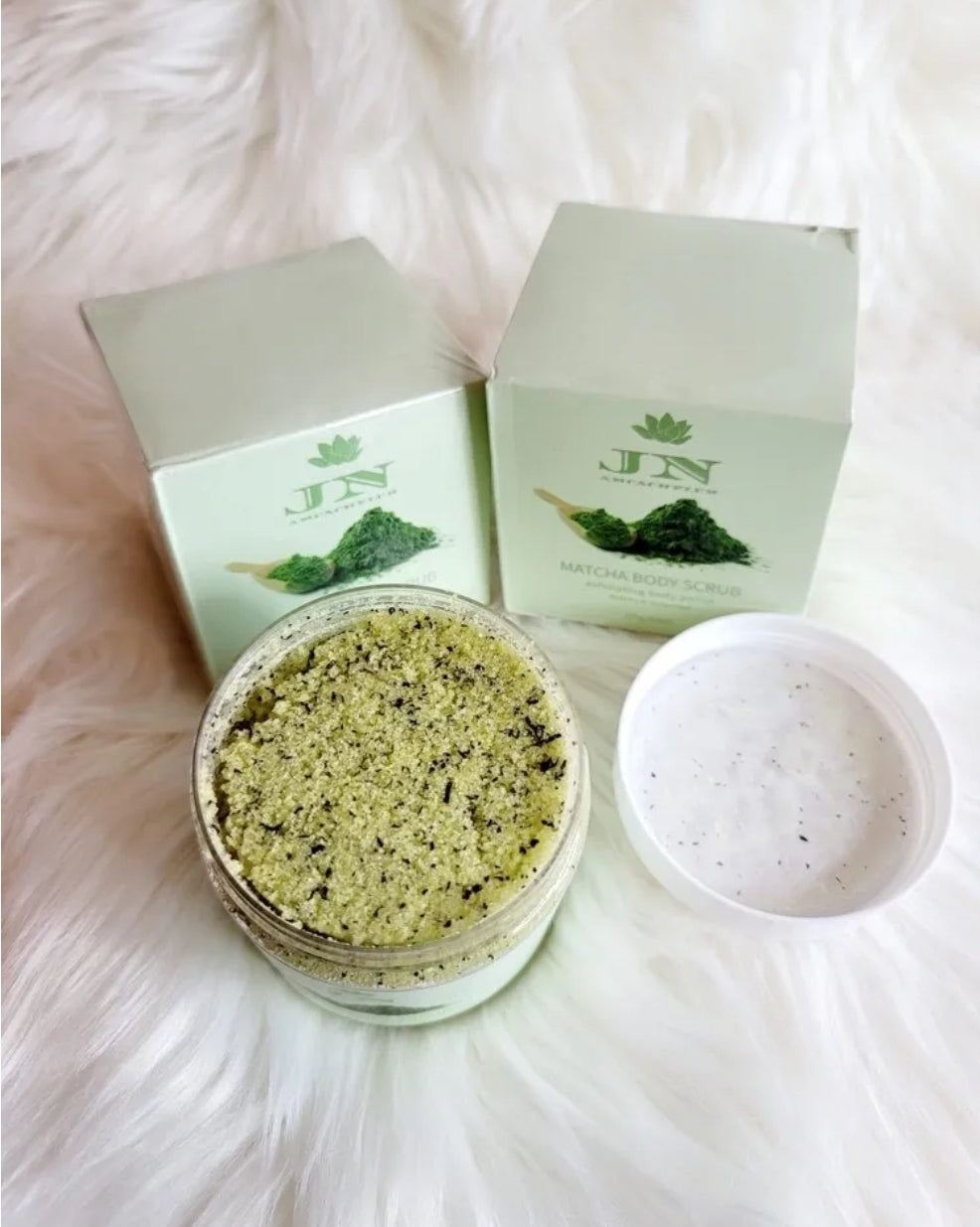 JNA matcha green tea body scrub with its packaging.